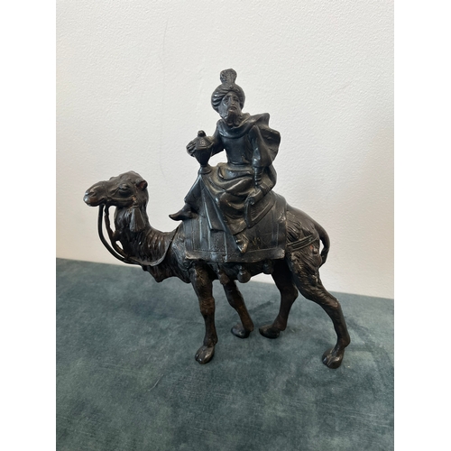 157 - Bronze model of a man sat on camel