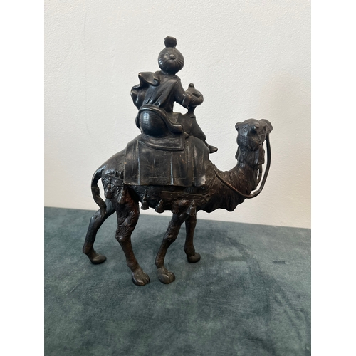 157 - Bronze model of a man sat on camel