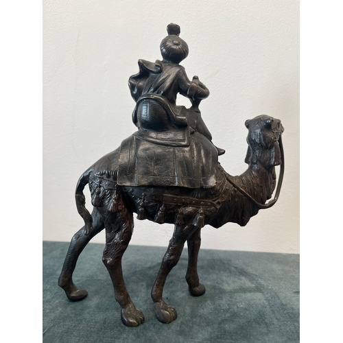 157 - Bronze model of a man sat on camel