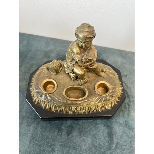 163 - Antique bronze model of a child with toys and dog. On a marble base