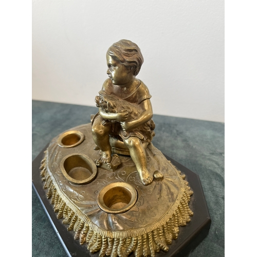 163 - Antique bronze model of a child with toys and dog. On a marble base