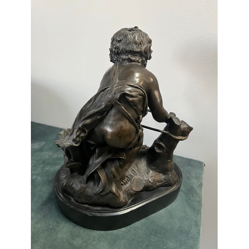 184 - Large modern bronze model of a cherub boy with a chicken. On marble base