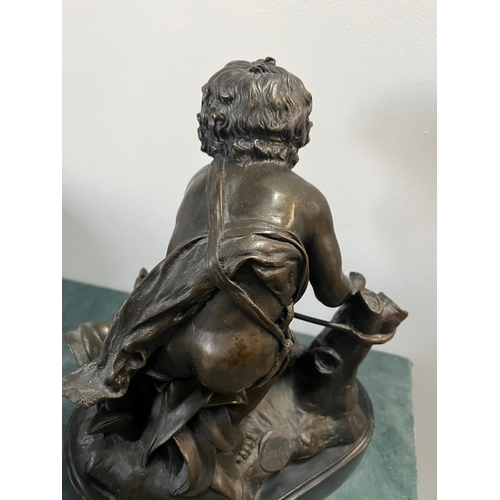 184 - Large modern bronze model of a cherub boy with a chicken. On marble base