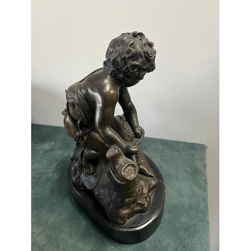 184 - Large modern bronze model of a cherub boy with a chicken. On marble base