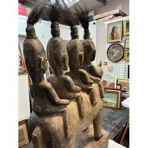 255 - Large central African carved tribal figure of four horse riders 

55cm wide x 80cm high