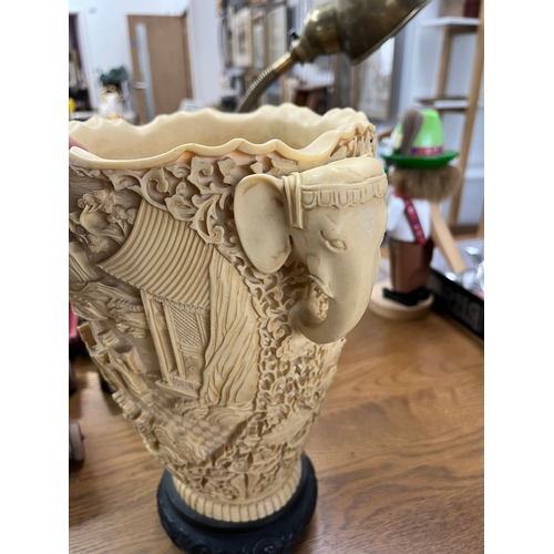 260 - Large resin vase featuring elephants and oriental scenes