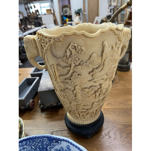 260 - Large resin vase featuring elephants and oriental scenes