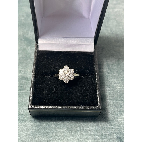 504 - 18ct white gold and diamond flower cluster ring approximately .80 ct