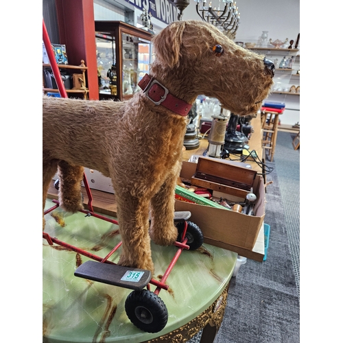 315 - Vintage Tri-Ang - International Model Aircraft Ltd push along mohair dog