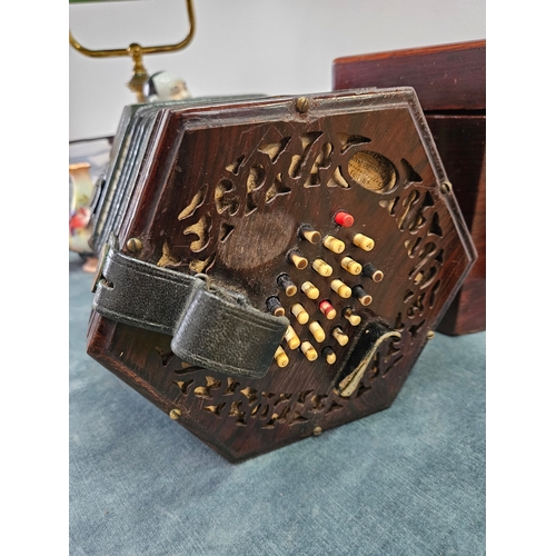 379 - Victorian forty eight button concertina by Lachenal with pierced fretwork. Within its original rosew... 