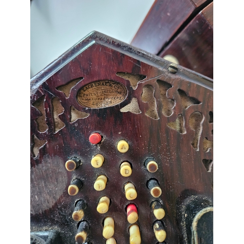 379 - Victorian forty eight button concertina by Lachenal with pierced fretwork. Within its original rosew... 