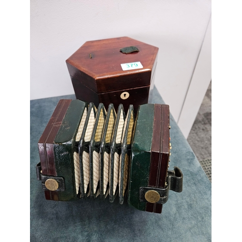 379 - Victorian forty eight button concertina by Lachenal with pierced fretwork. Within its original rosew... 