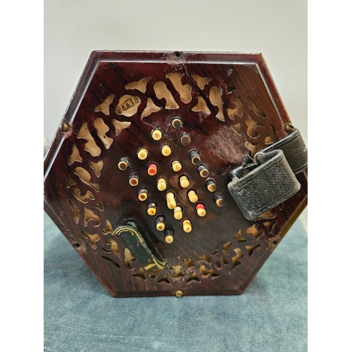 379 - Victorian forty eight button concertina by Lachenal with pierced fretwork. Within its original rosew... 