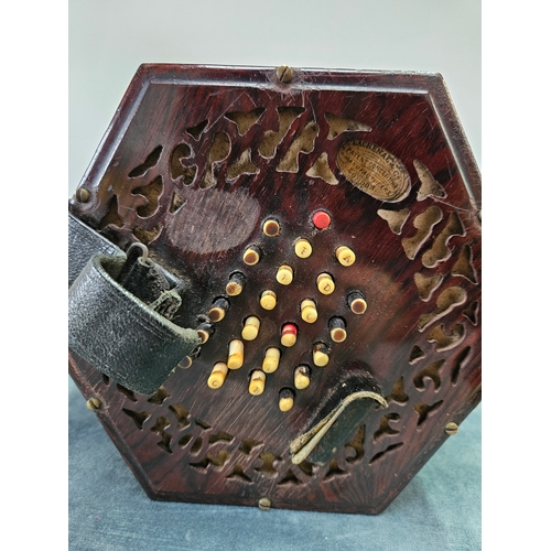 379 - Victorian forty eight button concertina by Lachenal with pierced fretwork. Within its original rosew... 