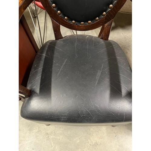 2 - Pair of black leather armchairs with brass stud details