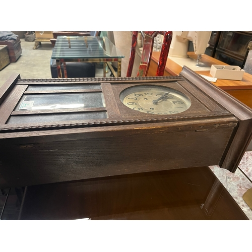 53 - 1930's wall clock with pendulum and key