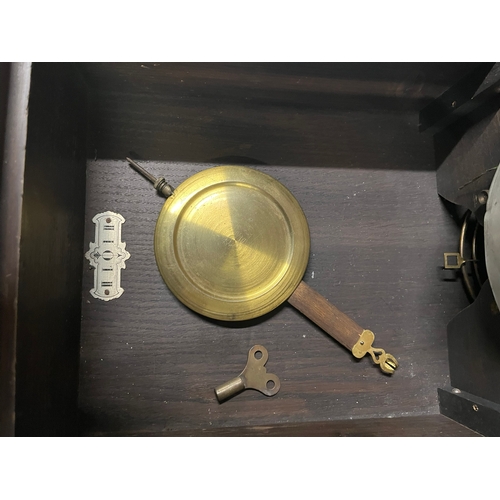 53 - 1930's wall clock with pendulum and key