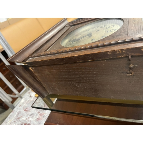 53 - 1930's wall clock with pendulum and key