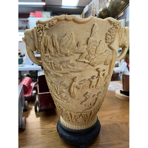 260 - Large resin vase featuring elephants and oriental scenes