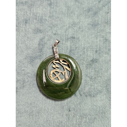 544 - Silver and jade necklace pendant