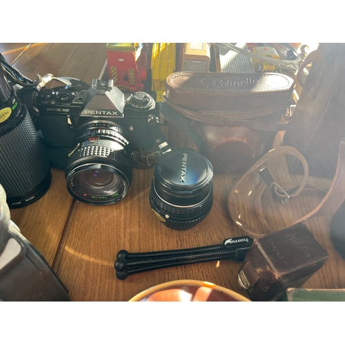 203 - Assortment of vintage camera equipment and Bell and Howell boxed projector