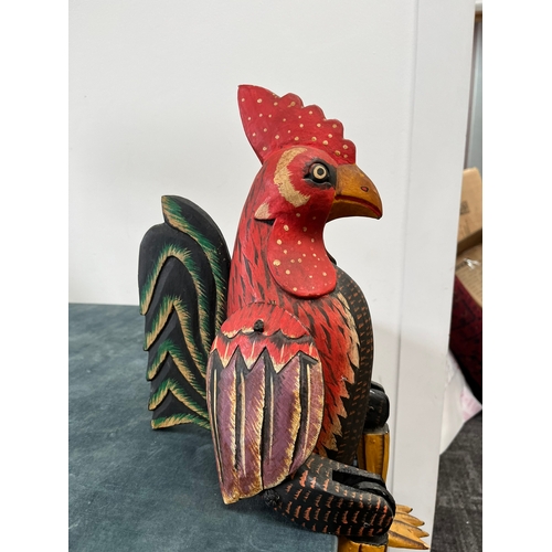 247 - Wooden carved seated chicken with swinging legs