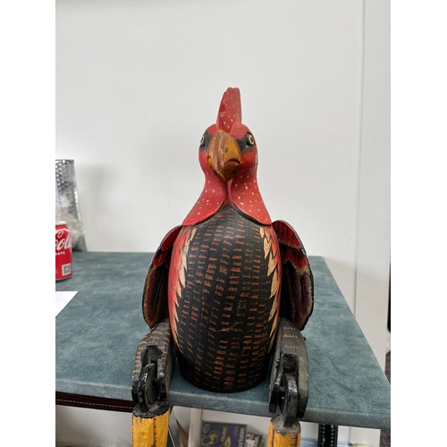 247 - Wooden carved seated chicken with swinging legs