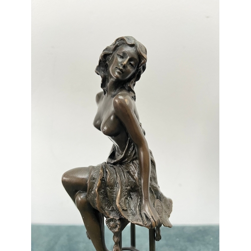 259 - Art Deco style bronze modelled as a bare chested female figure, seated upon a chair, signed 'Pierre ... 