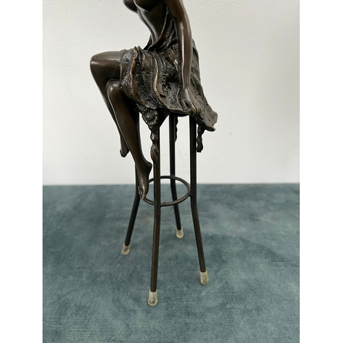 259 - Art Deco style bronze modelled as a bare chested female figure, seated upon a chair, signed 'Pierre ... 