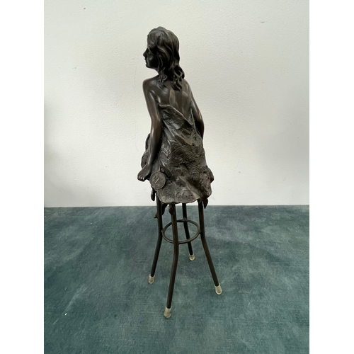 259 - Art Deco style bronze modelled as a bare chested female figure, seated upon a chair, signed 'Pierre ... 