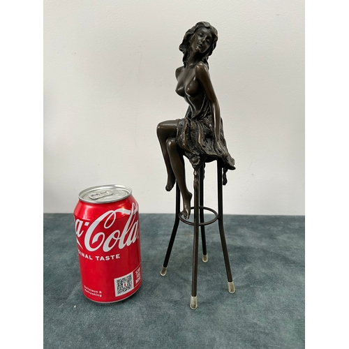 259 - Art Deco style bronze modelled as a bare chested female figure, seated upon a chair, signed 'Pierre ... 