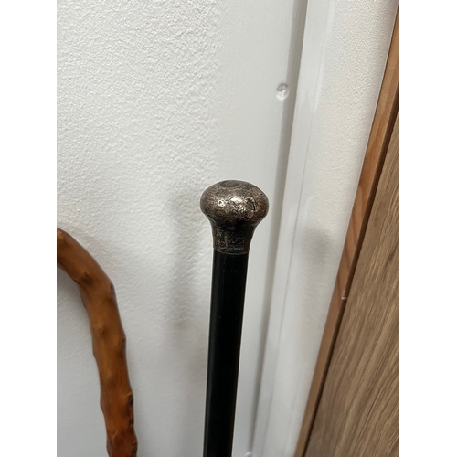 319 - Silver topped walking stick and walking stick with cabochon