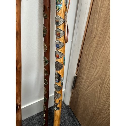 321 - 4 x walking sticks including antler handle, Huskey with badges.