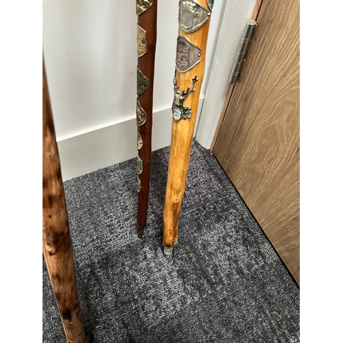 321 - 4 x walking sticks including antler handle, Huskey with badges.