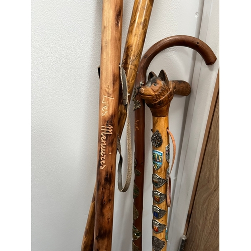 321 - 4 x walking sticks including antler handle, Huskey with badges.