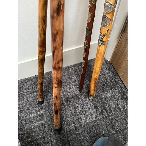 321 - 4 x walking sticks including antler handle, Huskey with badges.