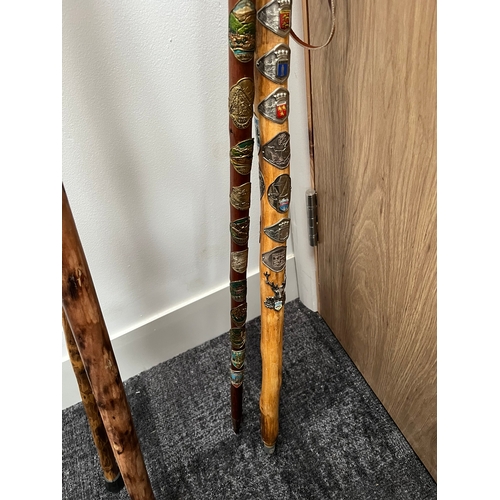 321 - 4 x walking sticks including antler handle, Huskey with badges.