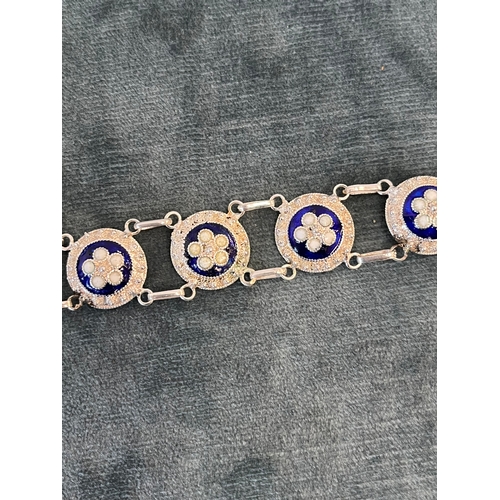 513 - Silver and enamel bracelet decorated with flowers