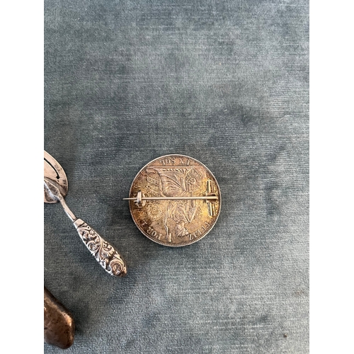 539 - Silver coin brooch, silver bookmark and silver handled file