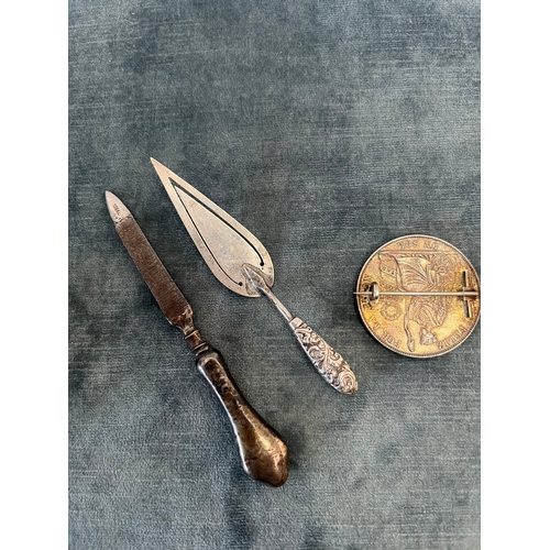 539 - Silver coin brooch, silver bookmark and silver handled file