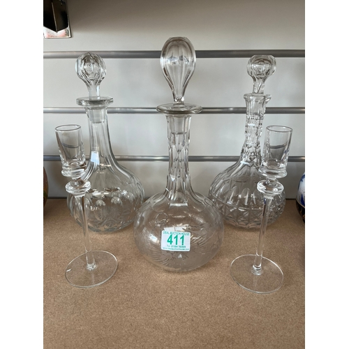 411 - 3 x Glass decanters and two candle sticks