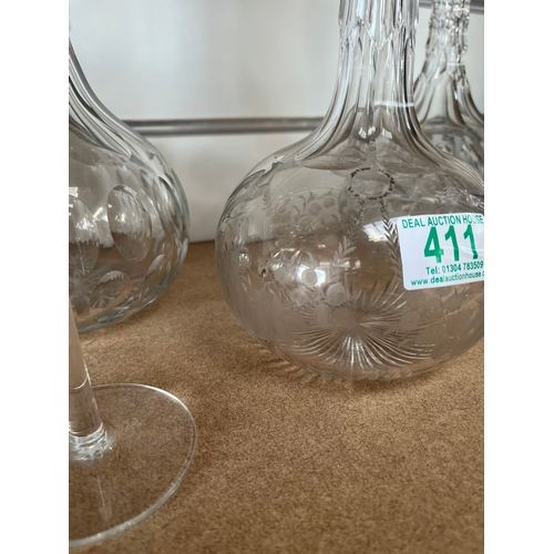 411 - 3 x Glass decanters and two candle sticks