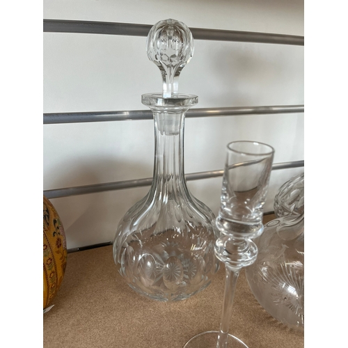 411 - 3 x Glass decanters and two candle sticks