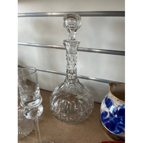 411 - 3 x Glass decanters and two candle sticks