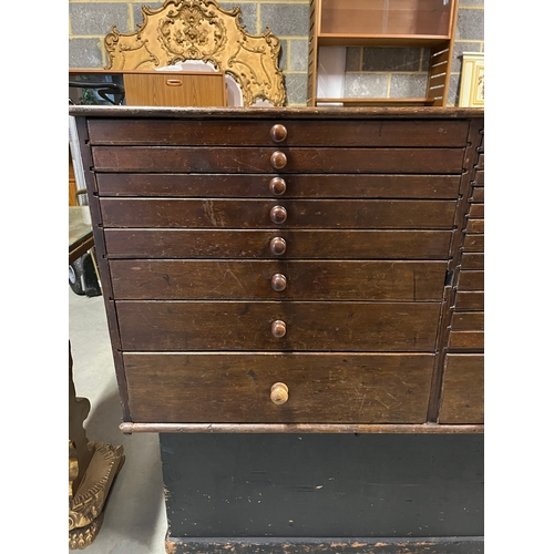 46 - Large antique chest of collectors drawers with a side cupboard