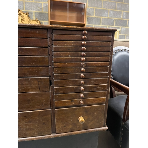 46 - Large antique chest of collectors drawers with a side cupboard