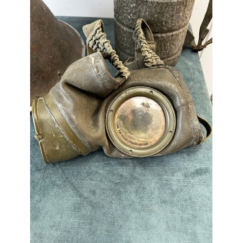 426 - British turtle helmet and German WWII gas mask