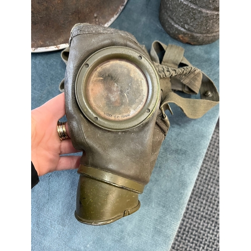 426 - British turtle helmet and German WWII gas mask