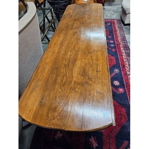 51 - Large antique drop leaf oak table