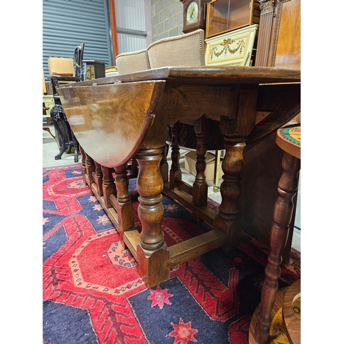 51 - Large antique drop leaf oak table